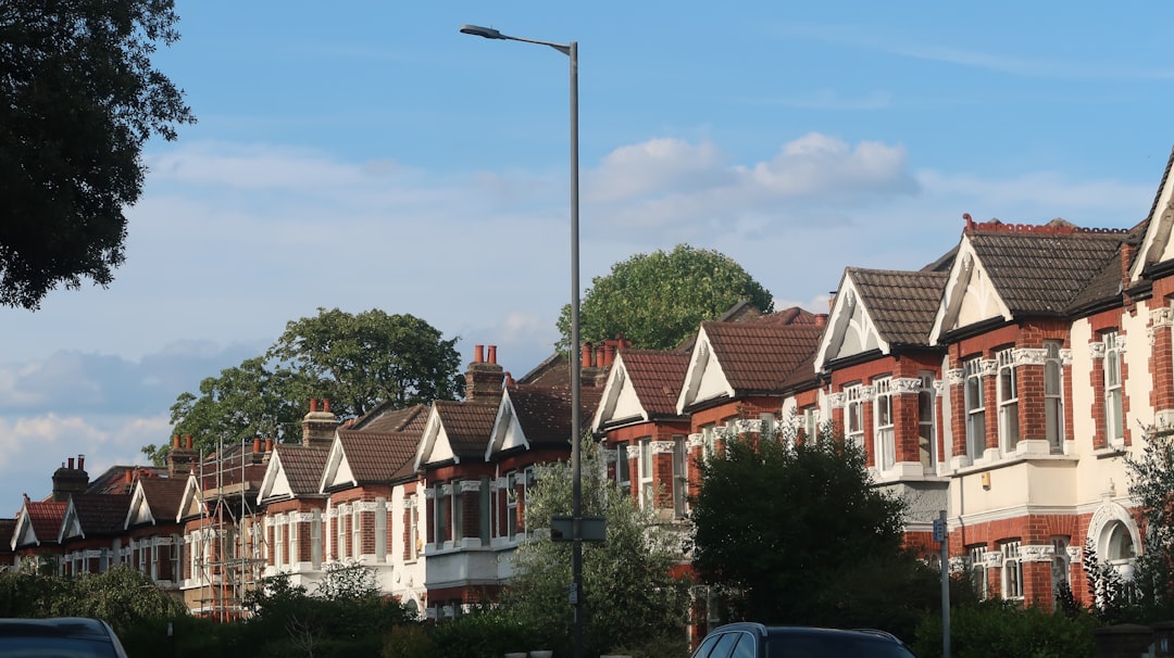 Social housing tenant reporting maintenance issues to housing officer