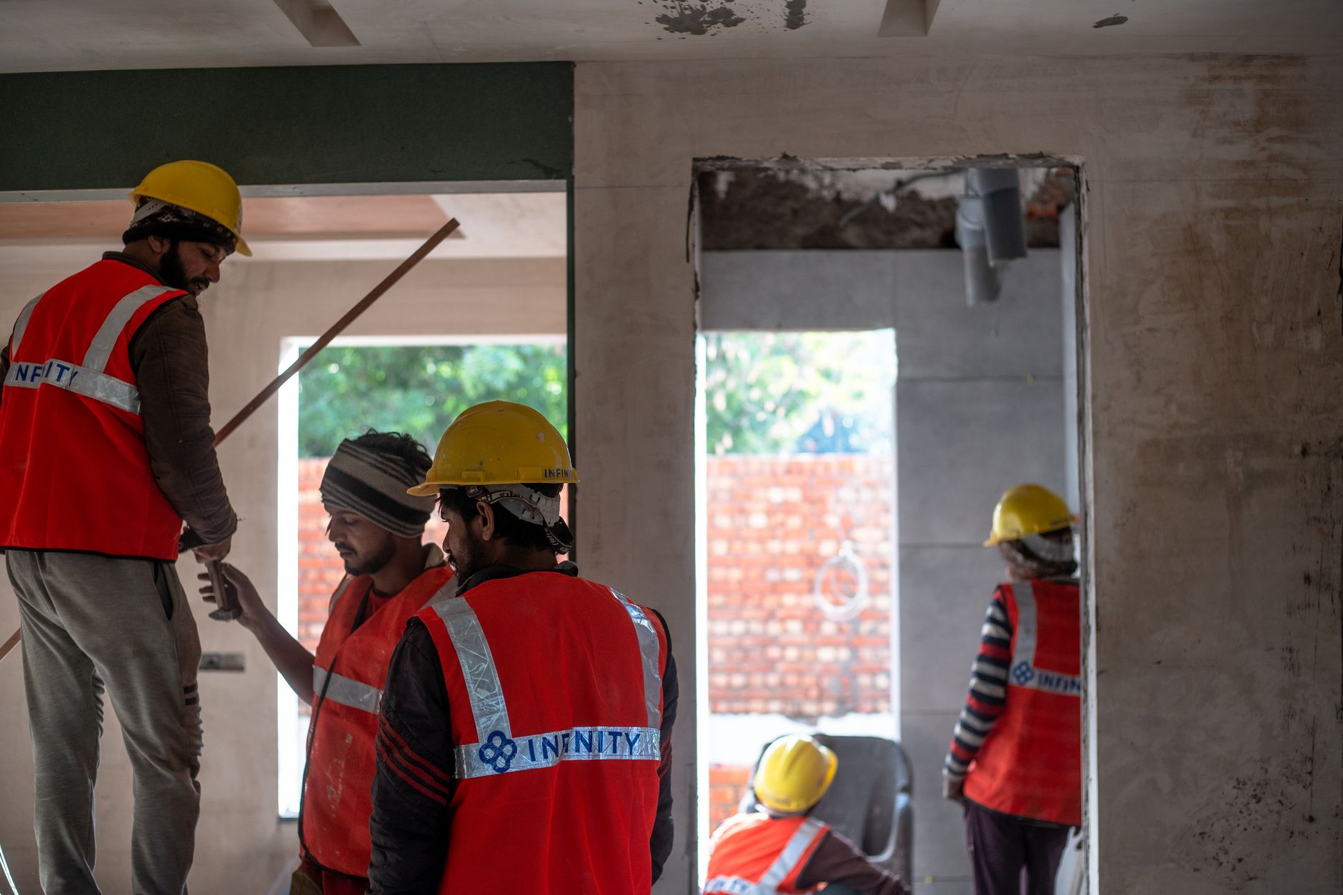 Construction workers building affordable homes