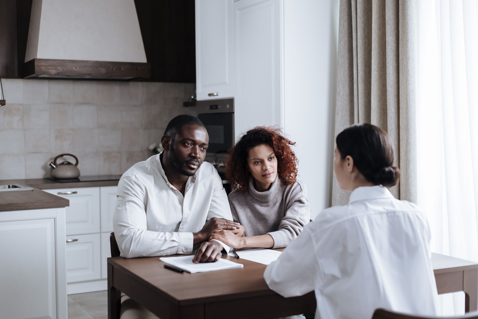 Social worker meeting with family in temporary housing