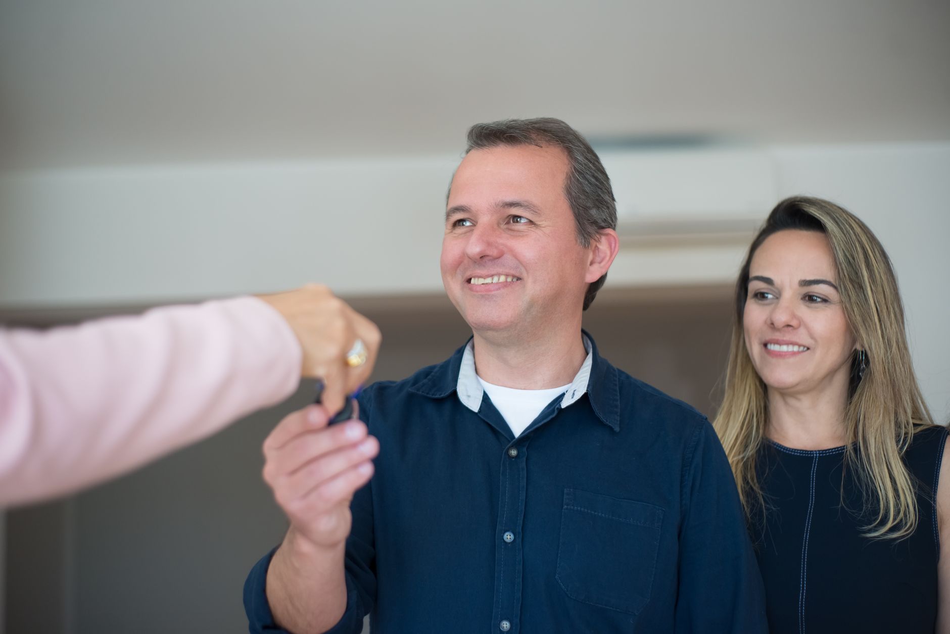 Happy tenant receiving keys to new social housing property