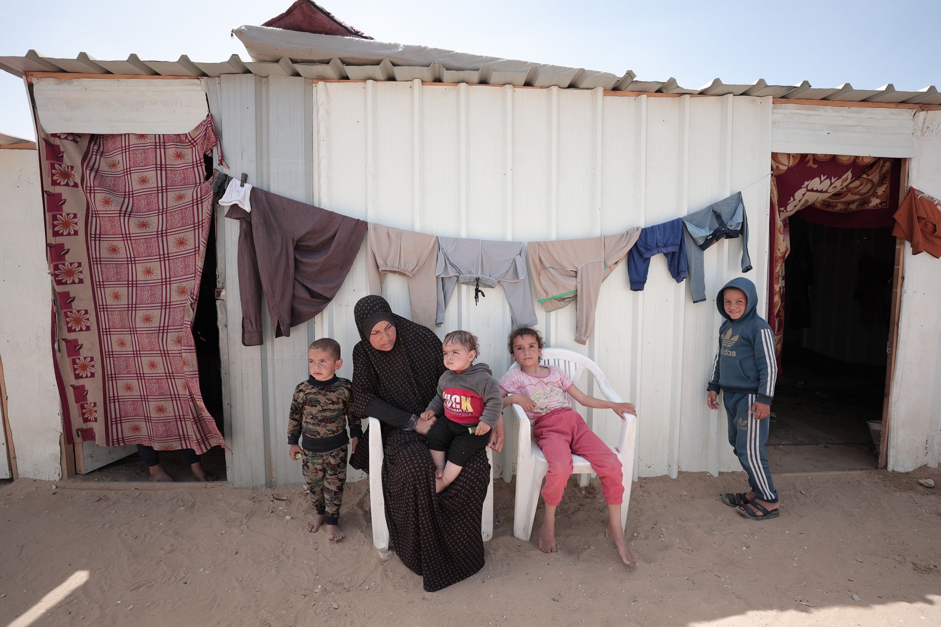 Family living in cramped temporary accommodation