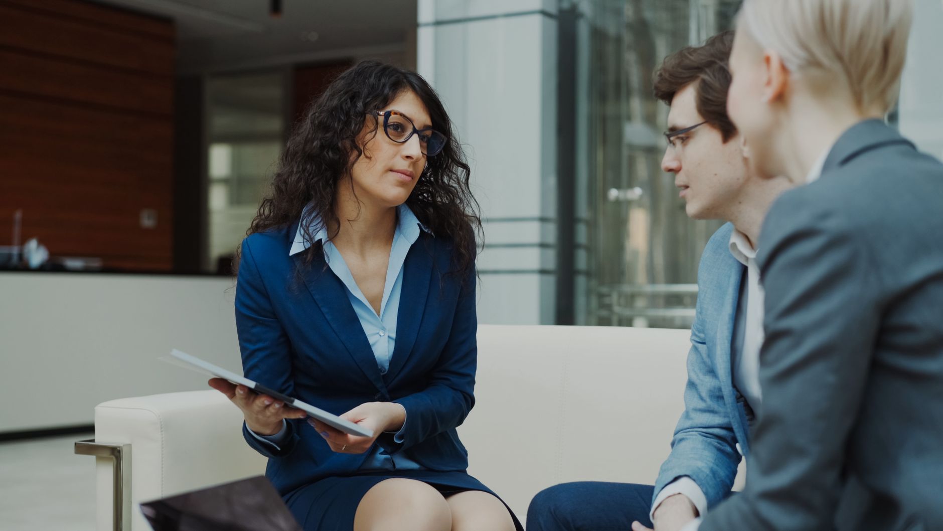 Professionals collaborating on housing management strategies in a modern office