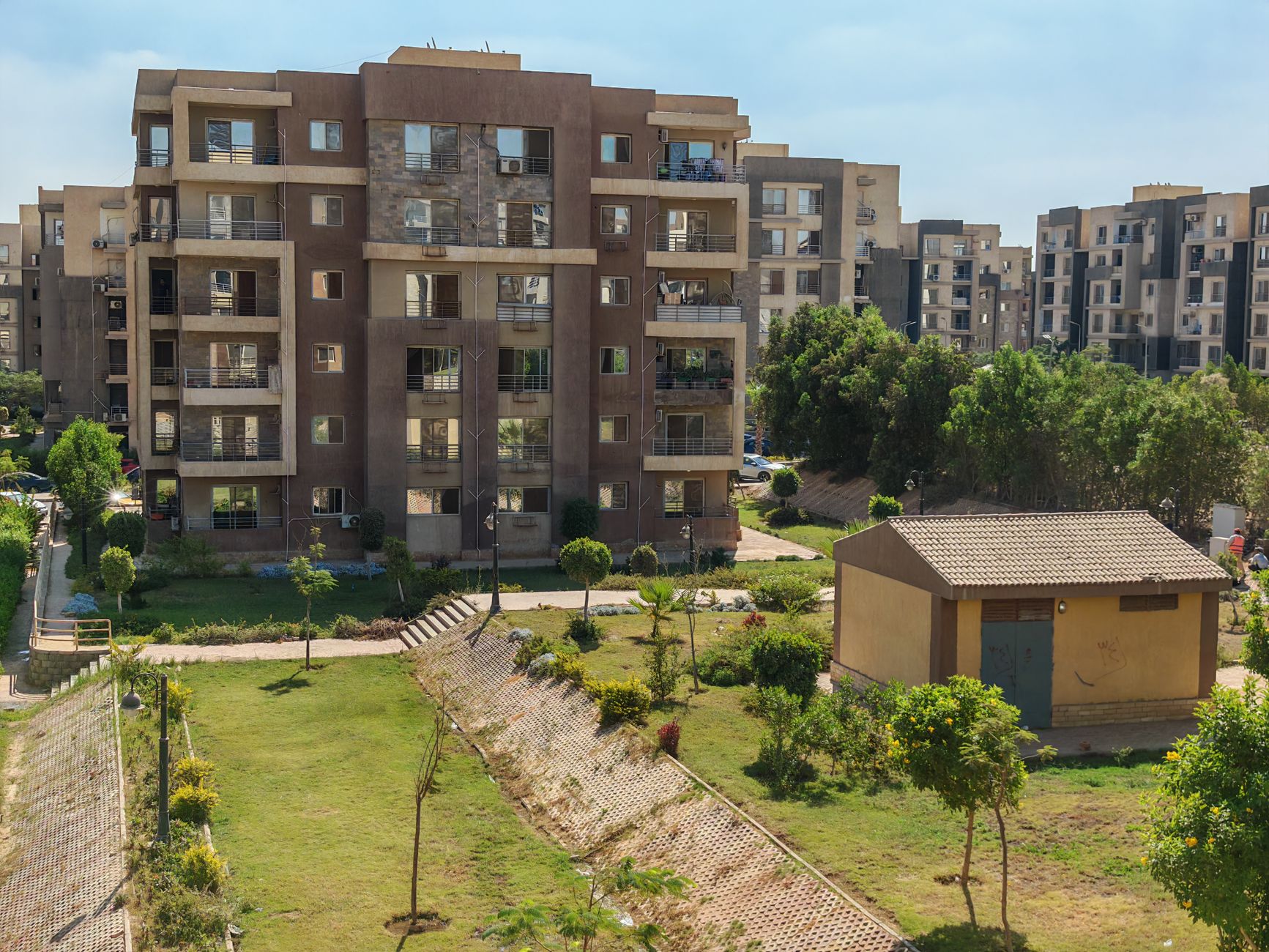 Modern affordable housing development with green spaces