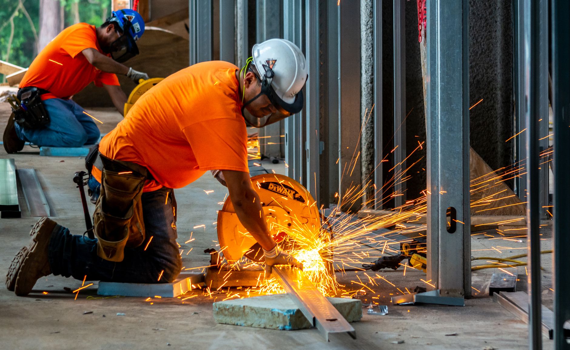Construction workers assembling modular housing units