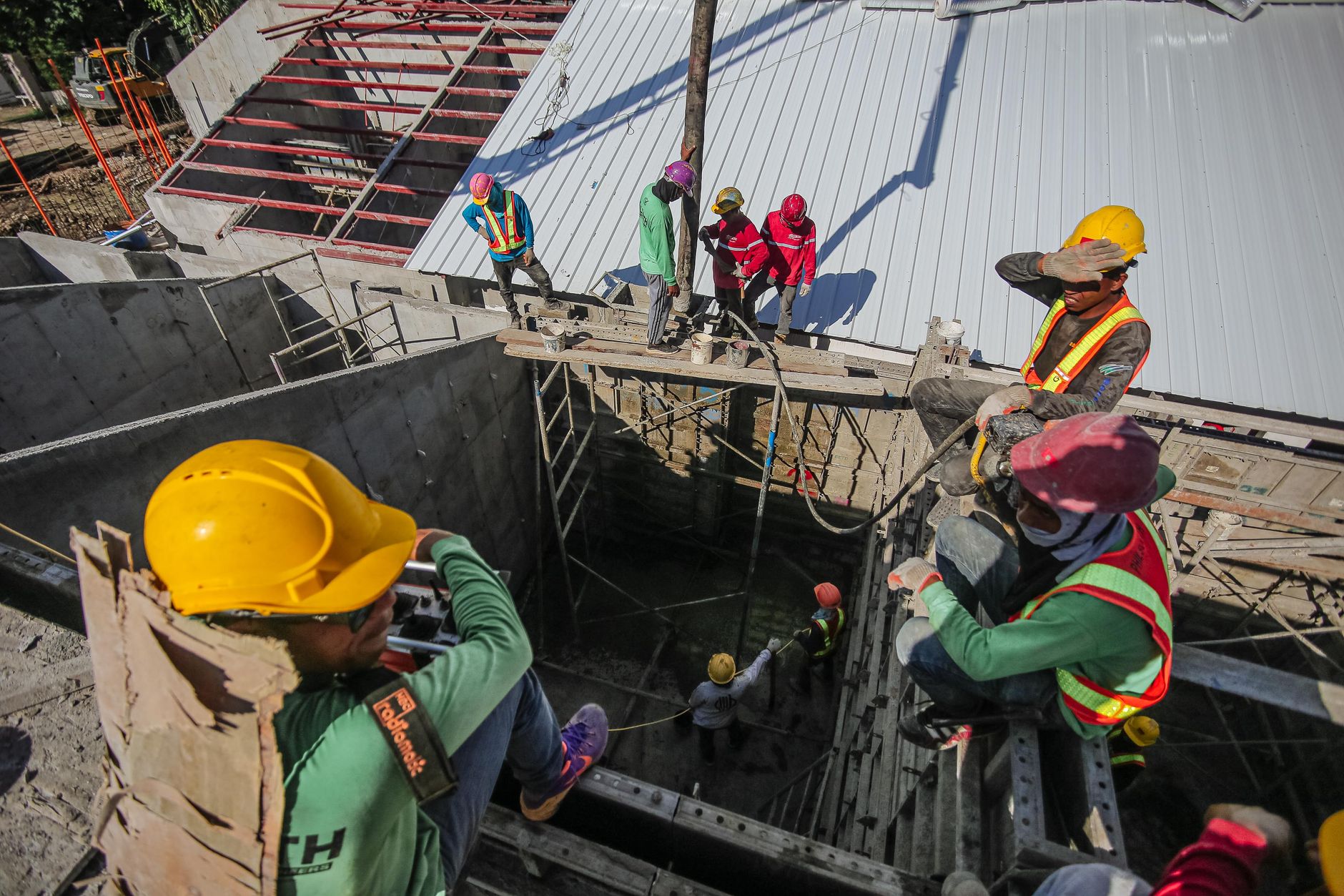 Construction workers building social housing - representing solutions