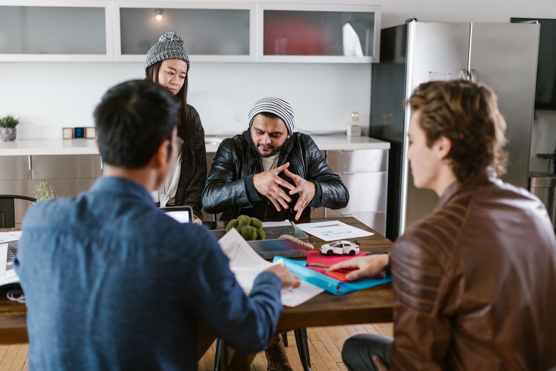 Team meeting discussing housing strategy