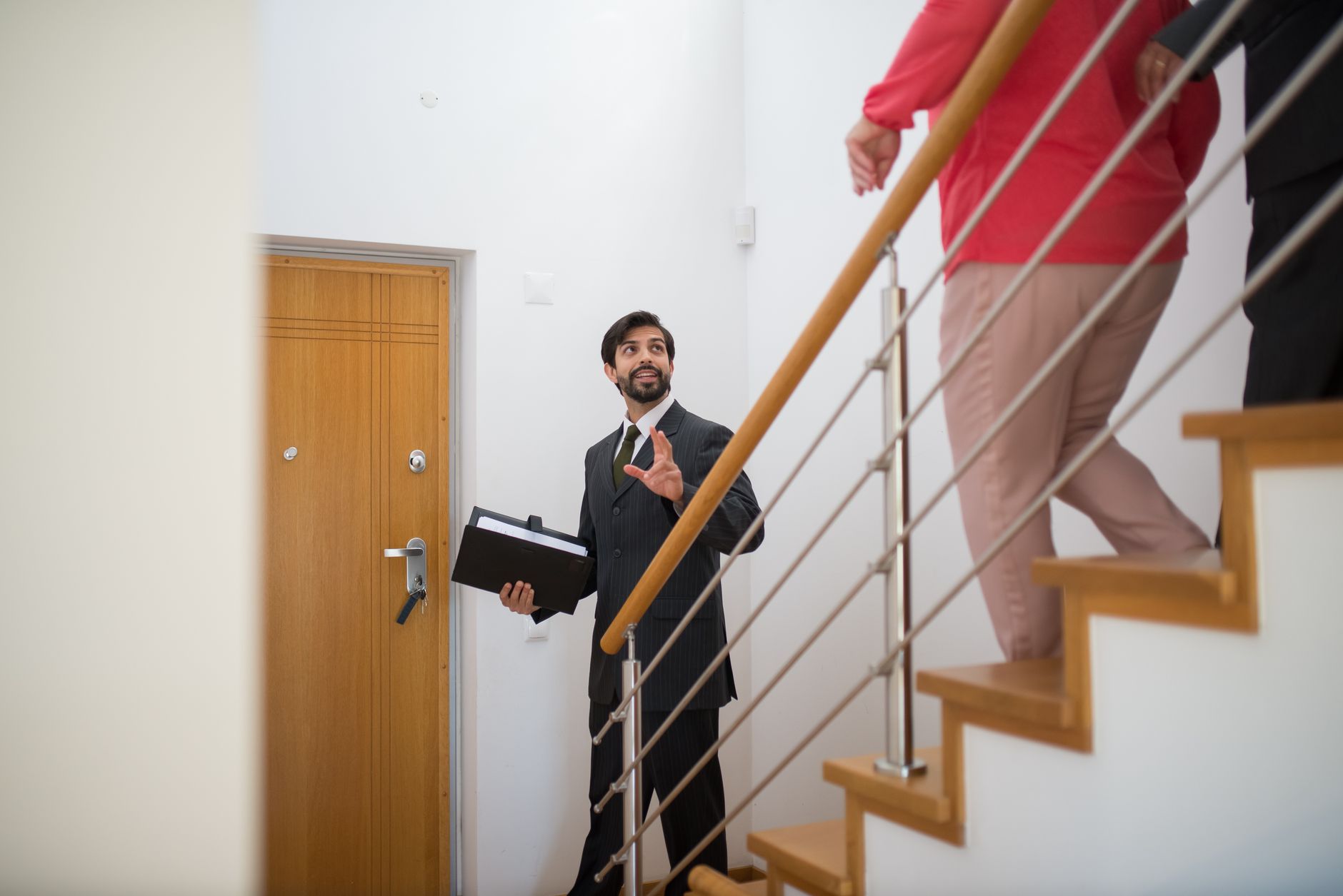 Property manager showing house keys to potential buyer