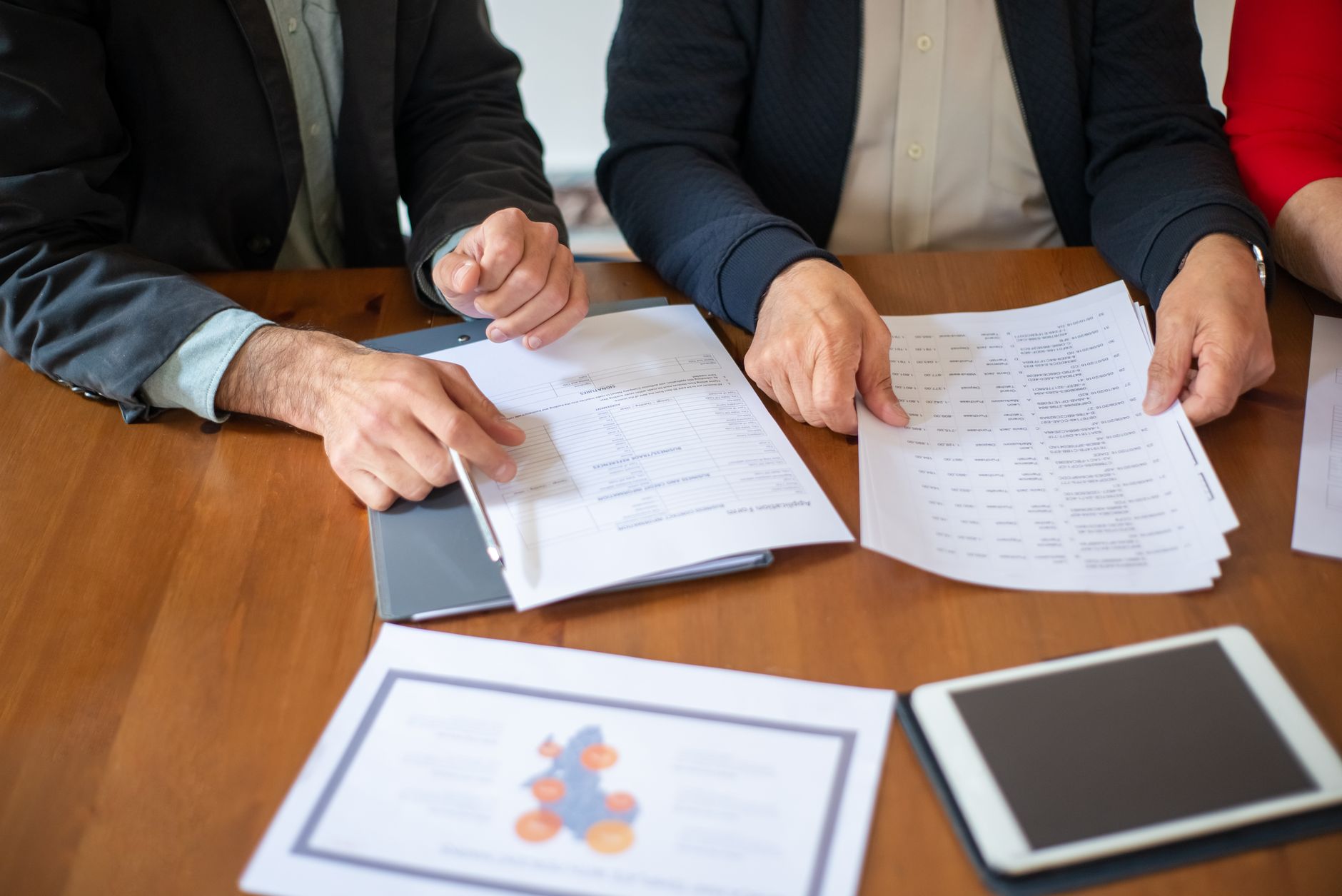 Social housing manager reviewing documents with tenant