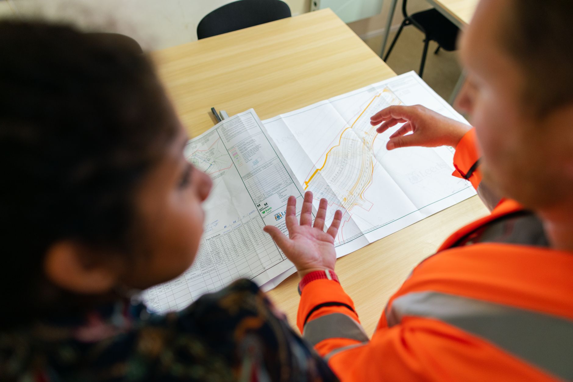 NHS professional meeting with housing officer - showing cross-sector collaboration