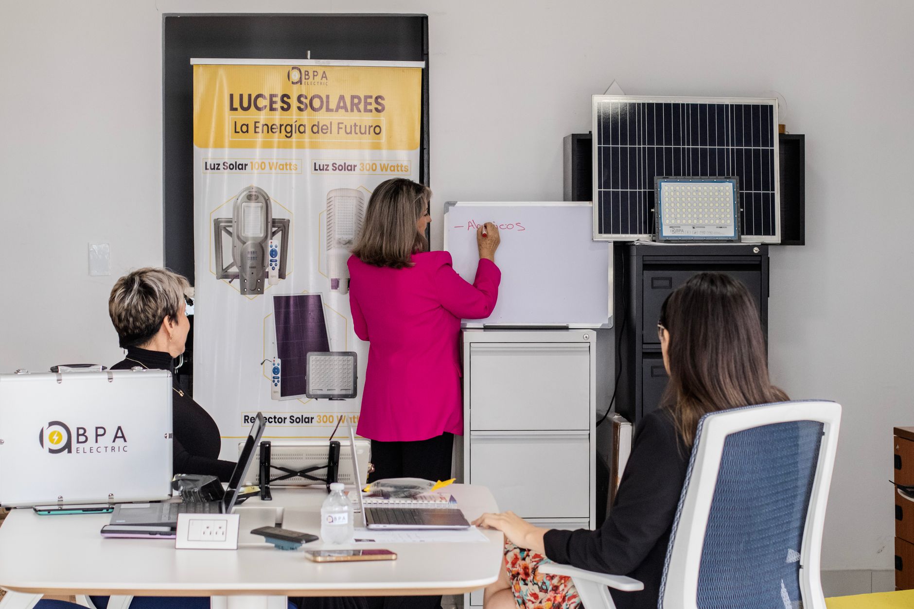 Housing officer discussing solar panel plans with tenants