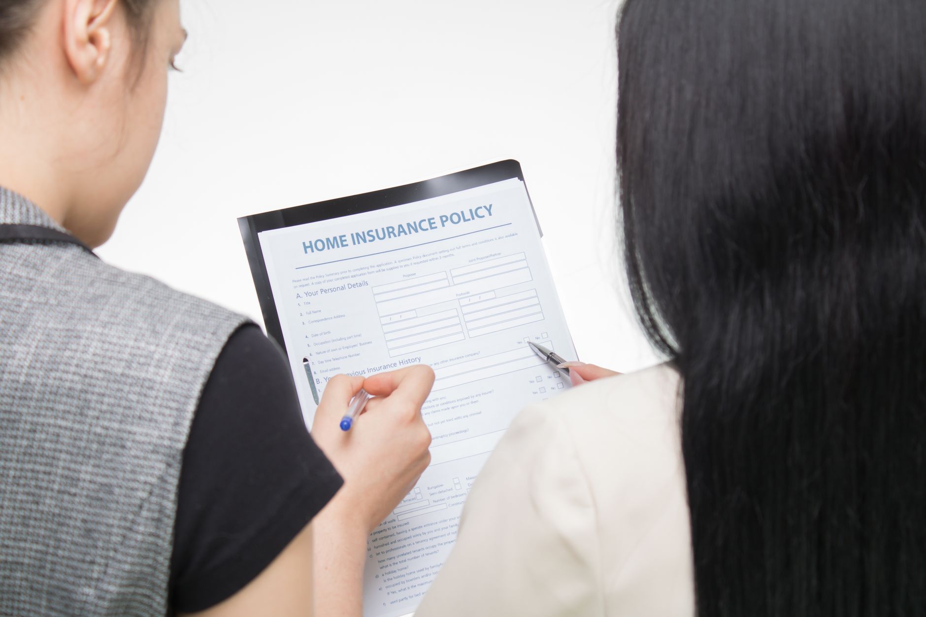 Social housing professionals in a meeting discussing policy documents