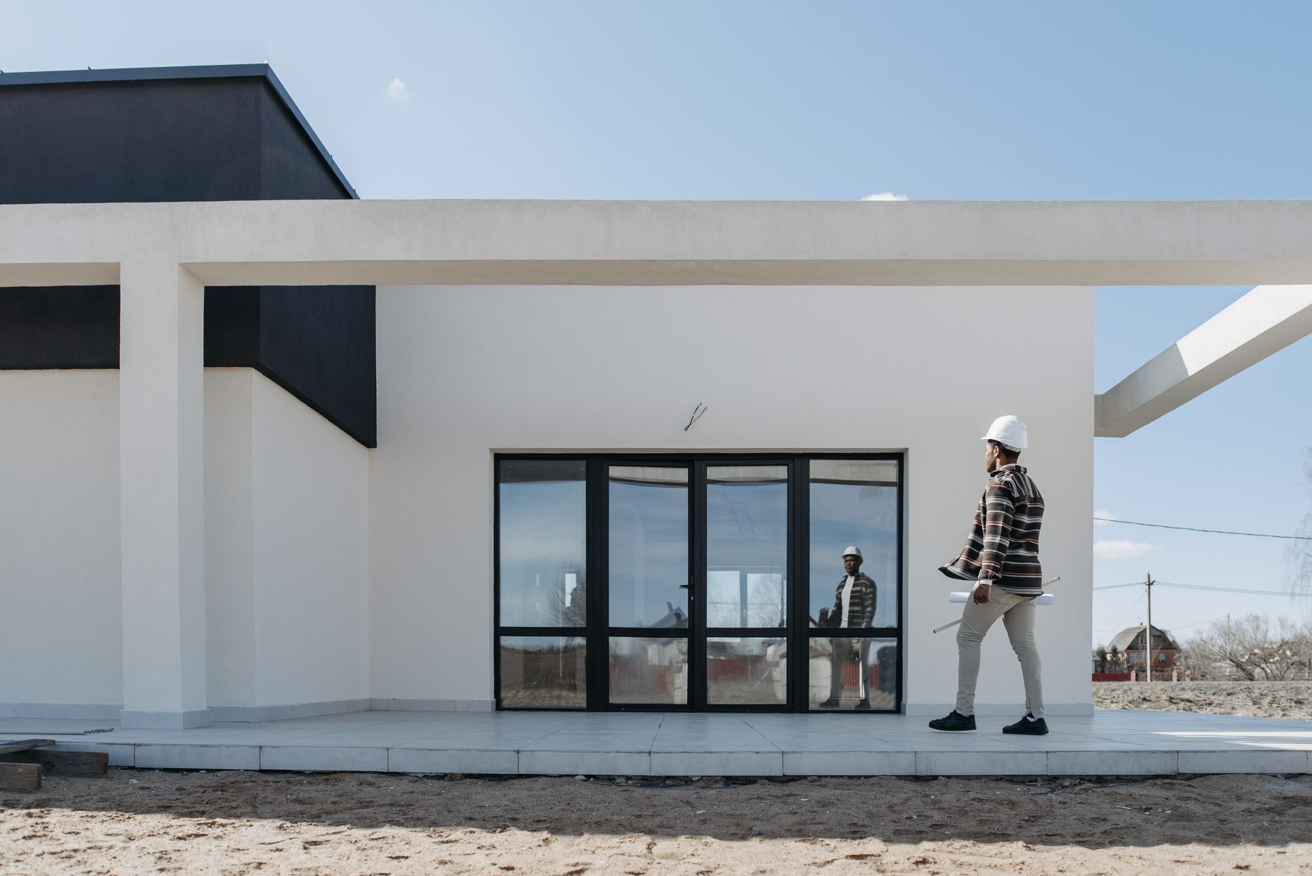 Modern HMO building exterior with professional workers entering