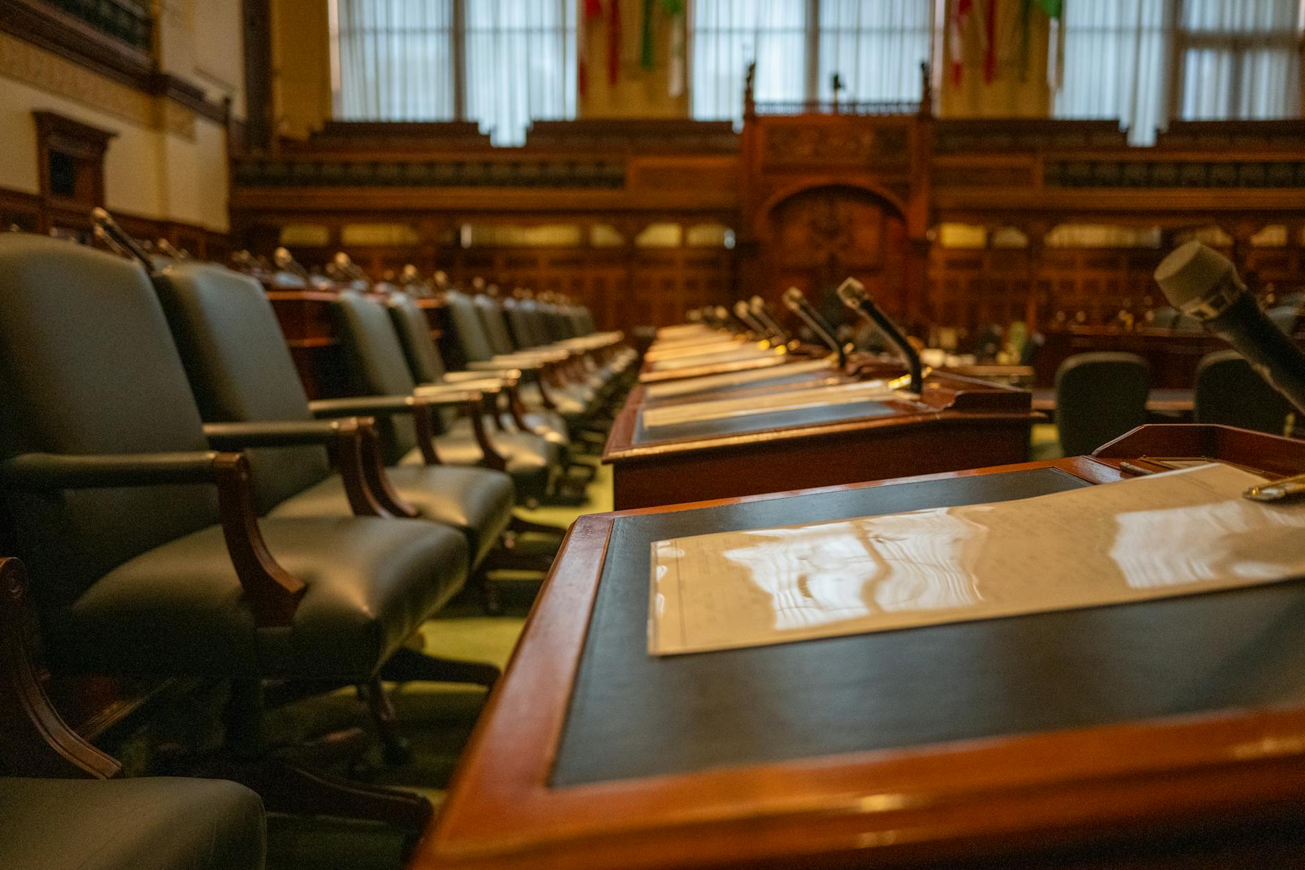 Council meeting discussing housing policy