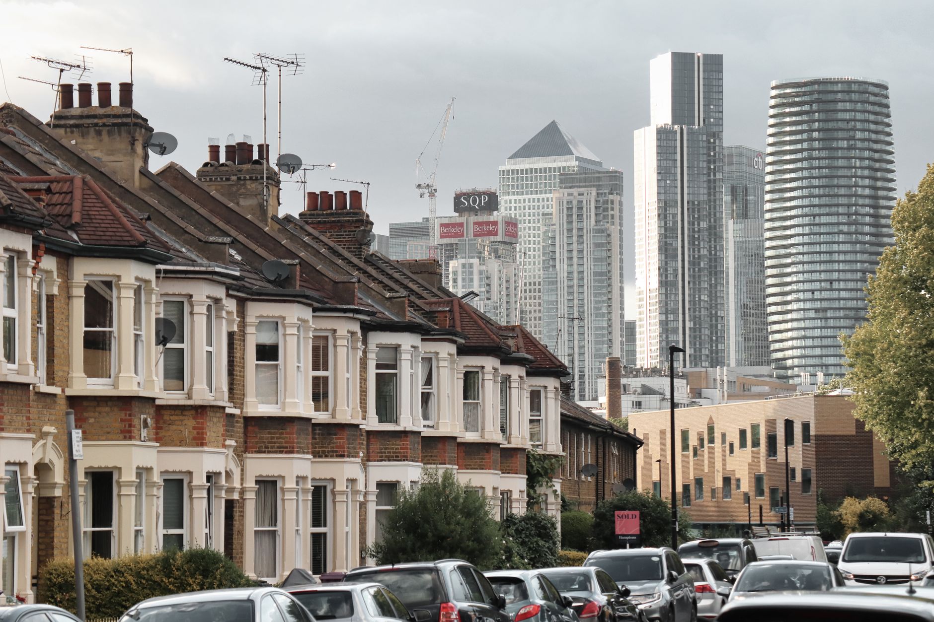 London skyline with social housing in foreground - showing contrast between luxury and affordable housing
