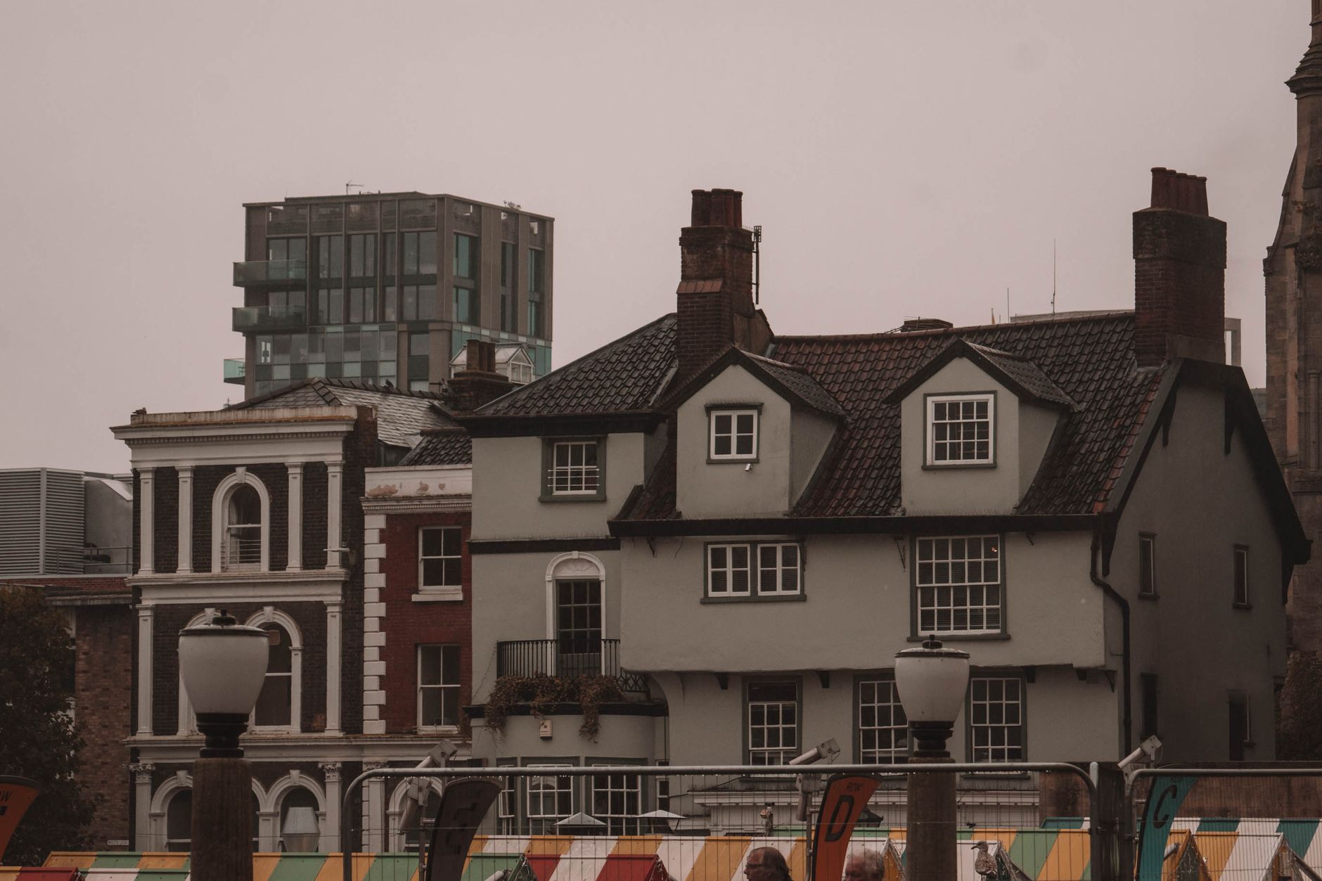 Street view showing contrast between traditional homes and HMO developments